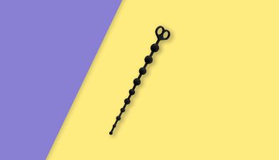 Schwarze Analkette aus Silikon von EIS auf lila-gelb geteiltem Hintergrund